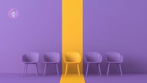 Web3 hiring mistakes illustrated by one standout yellow chair among purple chairs, showing the importance of finding the right candidate