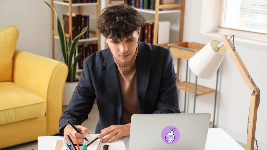 A person sitting at a desk with a laptop, learning how to prepare for a job interview using AI.